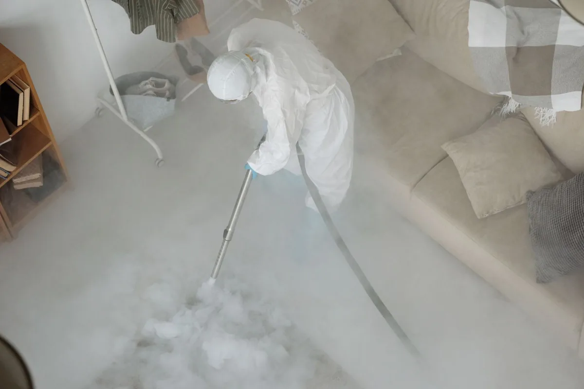Biohazard cleanup technician in protective equipment, Lake Shore, UT